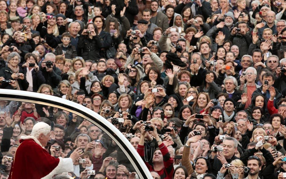 Pope Benedict XVI waves as he arrives for the Immaculate Conception celebration prayer in Piazza di 