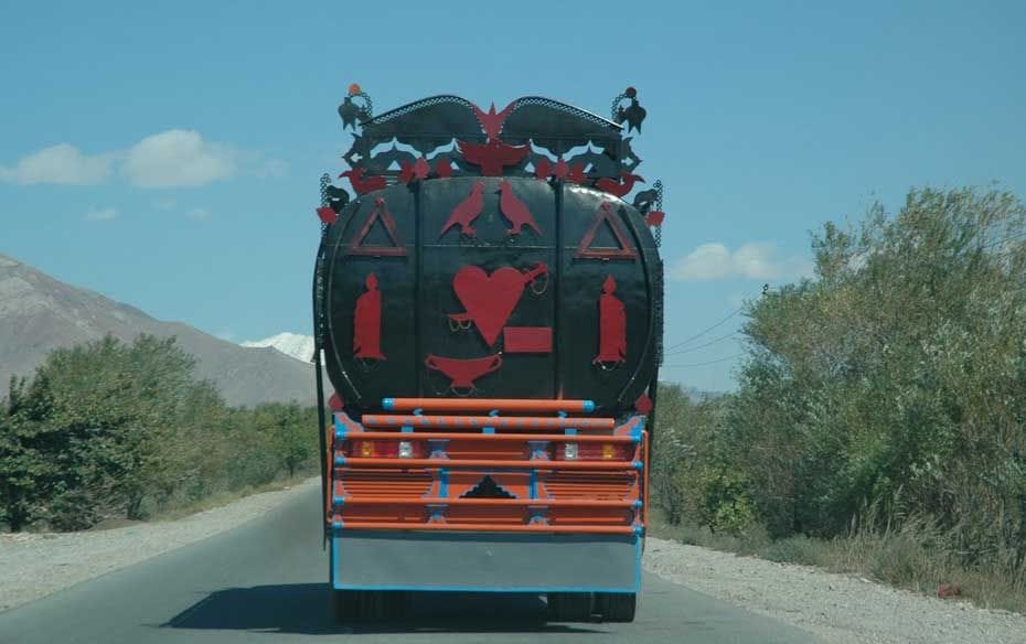 A fuel tanker. There are few tankers that do not sport such artwork. Black seems to be the preferred