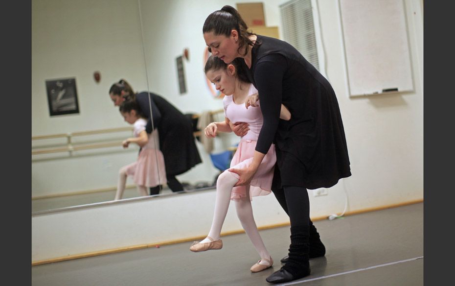 A Leg Up Sophia Jablonski (L) is assisted by Dr. Citlali Lopez-Ortiz during a dance class for childr