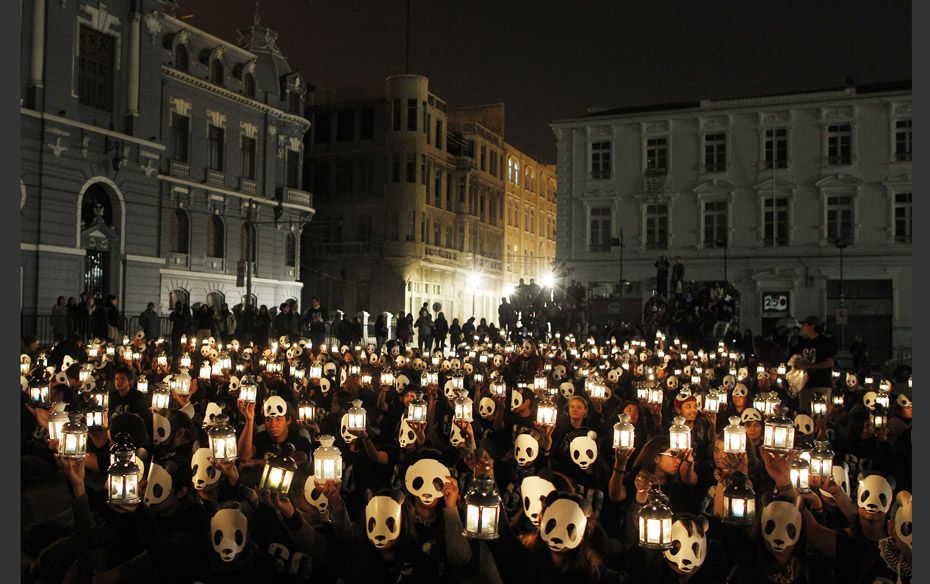  Show Me The Light Chilean volunteers hold up candles during Earth Hour in Valparaiso city, abo