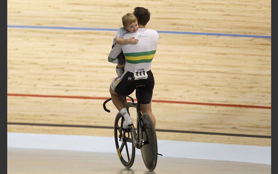 Cycle of Life Team Australia Shane Perkins celebrates with his son Aidan after winning the Men's