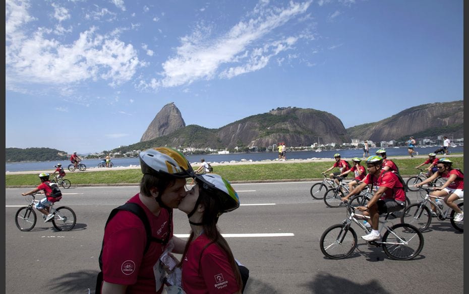 One For The Road A couple kiss in front of Sugar Loaf Mountain as cyclists participate in the World 