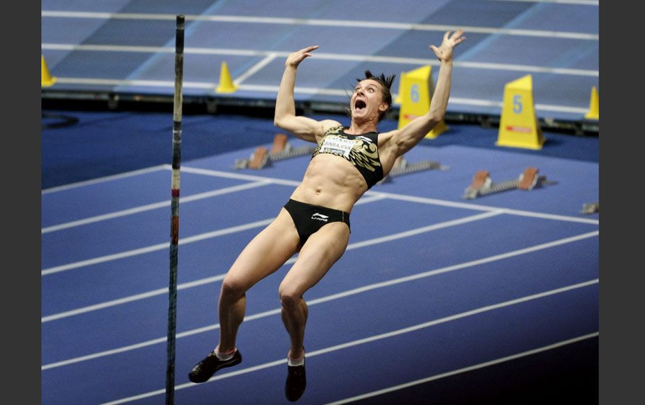 Yelena Isinbayeva of Russia reacts after clearing the bar to win the women's pole vault at the X