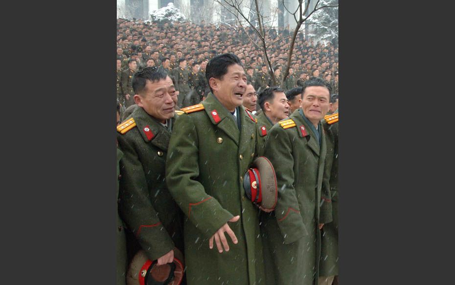 North Korean soldiers react during their late leader Kim Jong-il's funeral procession in Pyongya