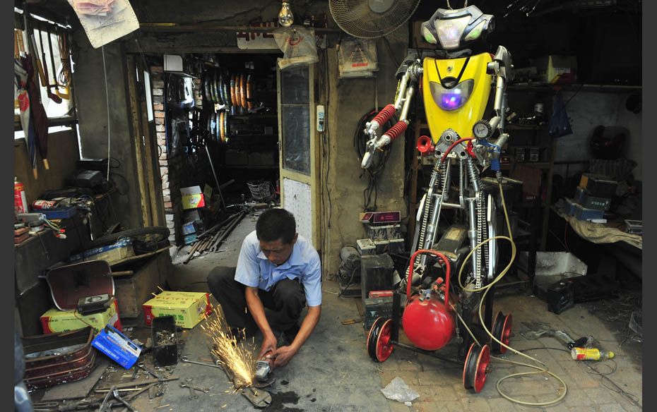 A 49-year-old electric bike mechanic who identified himself only as Wu welds a component to fit onto