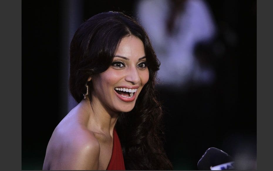 Bollywood actress Bipasha Basu smiles as she arrives on the green carpet for the International India