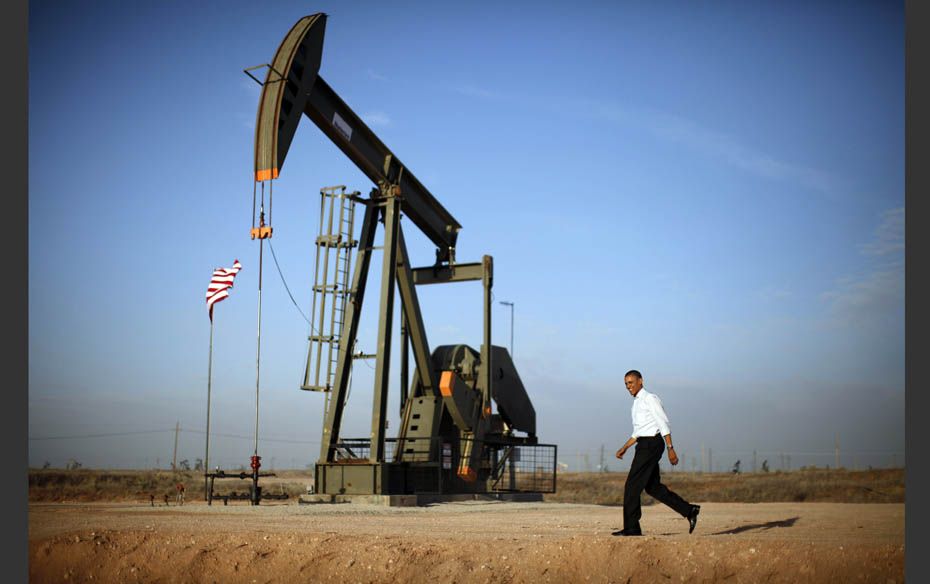 US President Barack Obama walks past a pumpjack on his way to deliver remarks on energy independence
