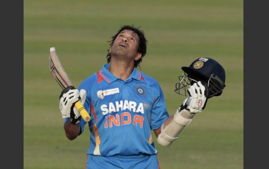 Sachin Tendulkar celebrates after he scored his 100th international  century during the Asia Cup One