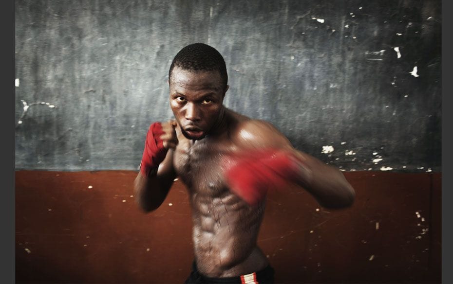 Olympic hopeful Abdul Rashid Bangura, 27, shadow boxes while training at the national stadium in Sie