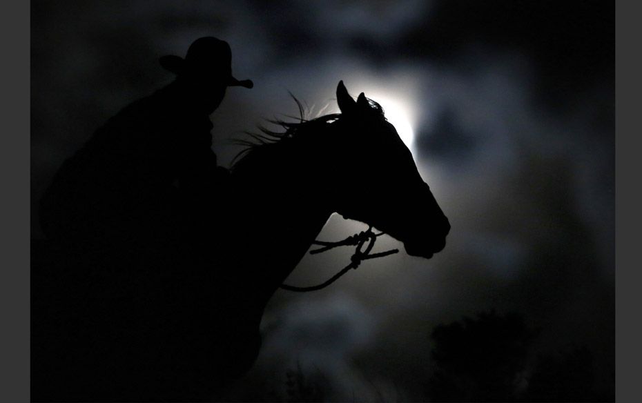 Wrangler Nate Cummins takes the opportunity to ride by moonlight, the night before the "Super M