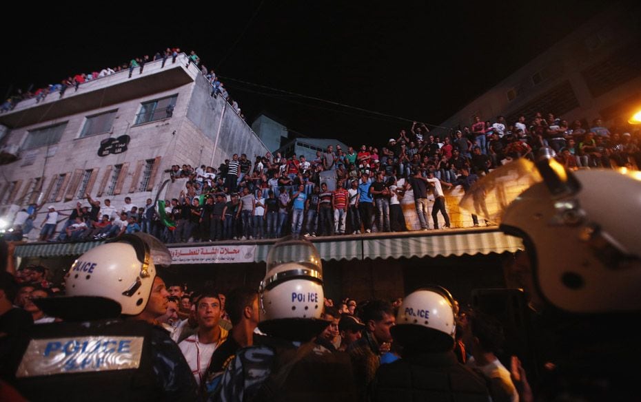 Palestinians watch the result of Arab Idol in the West Bank city of Ramallah. A 22-year-old singer M