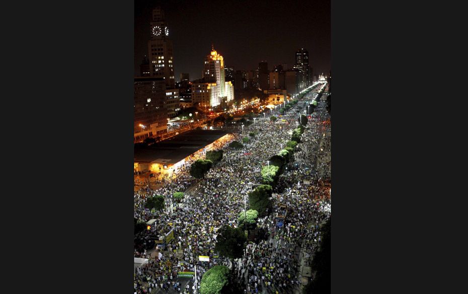 People take to the city centre of Rio de Janeiro, Brazil during  protests against rising rates 