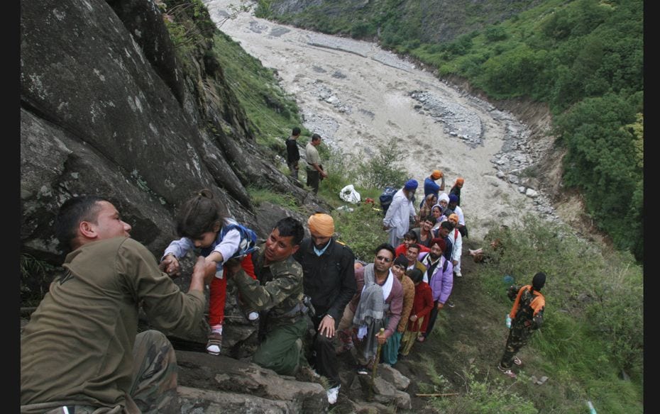 Soldiers rescue stranded people after heavy rains in the Himalayan state of Uttarakhand. India's