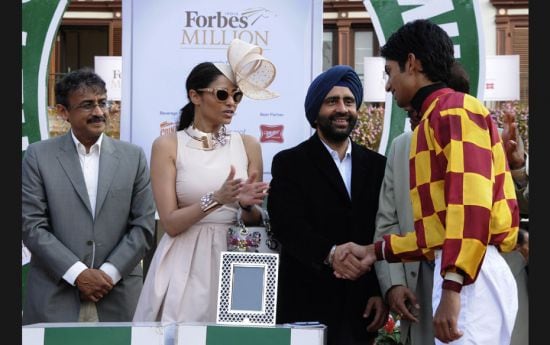 Vivek Jain, Kalyani Saha Chawla, Gurmeet Singh and Treveor Patel, the winning jockey of The Forbes I