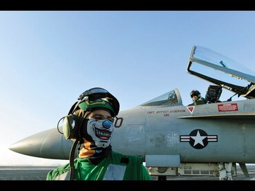 For this sailor, standing near an F/A-18E Super Hornet fighter jet on the USS Dwight D Eisenhower in