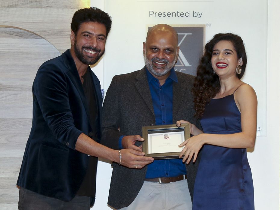 Ranveer Brar felicitates actress Mithila Palkar while Brian Carvalho looks on, at Forbes India 30 Un