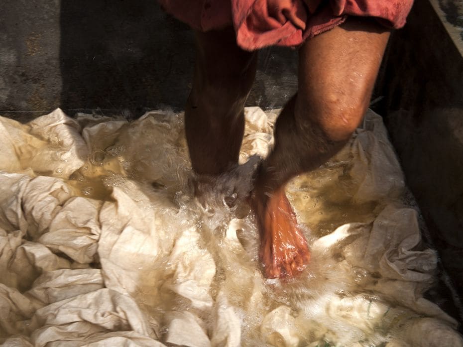 At the Handloom Weavers Development Society, fabrics are bleached in a solution of aloe vera, before