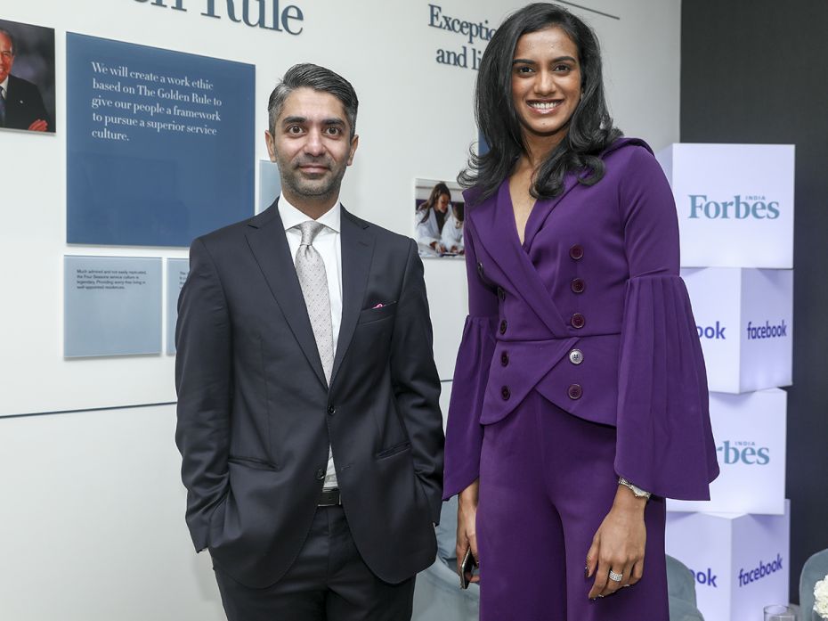 Olympic medallists shooter Abhinav Bindra and shuttler PV Sindhu strike a pose at the networking lou