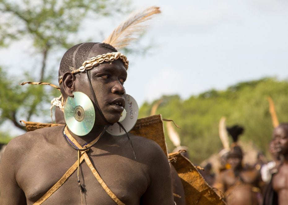 EthiopiaA Bodi tribesman sports DVDs as earrings during a Ka’el ceremony—observed during