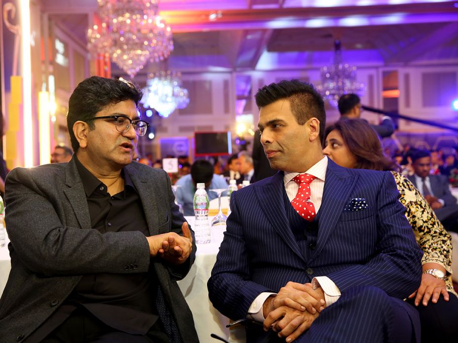 Filmmaker Karan Johar with Prasoon Joshi, writer and current chairman of CBFC, at the CNBC-TV18 Indi