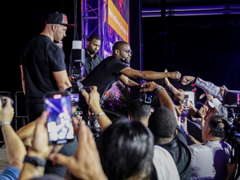 Former professional boxer Floyd Mayweather fists bump an attendee at the Bitcoin 2021 Convention. Ho