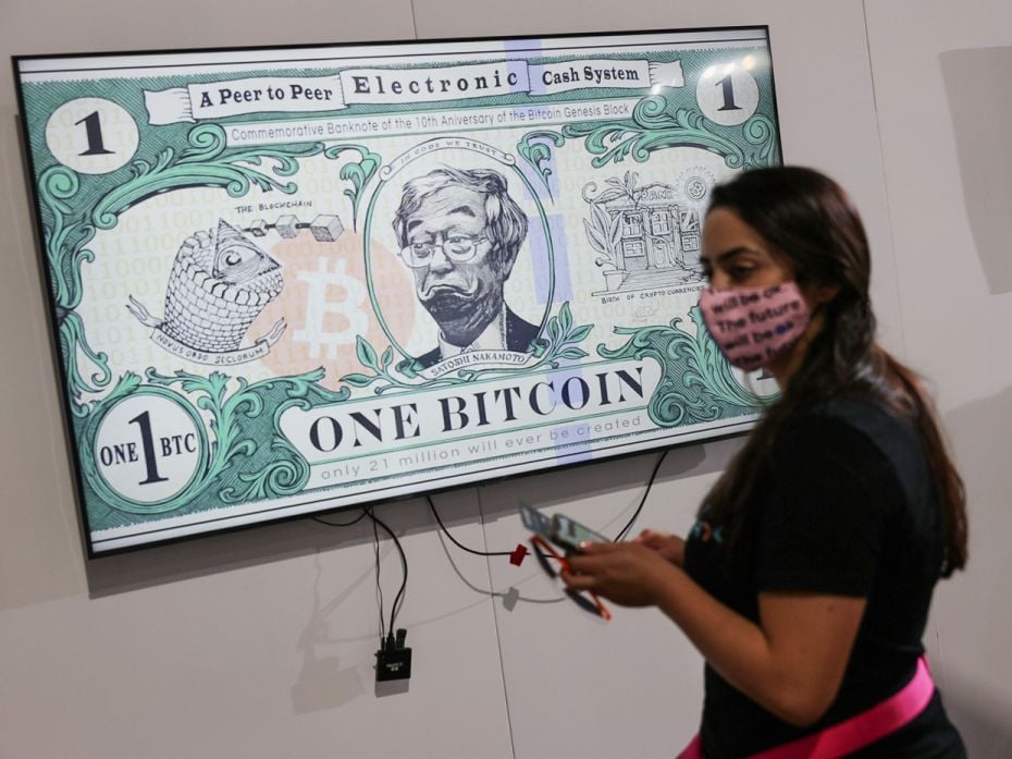 An art piece titled BTC Bank Note by artist Gus GG hangs at the Bitcoin 2021 Convention, featuring t