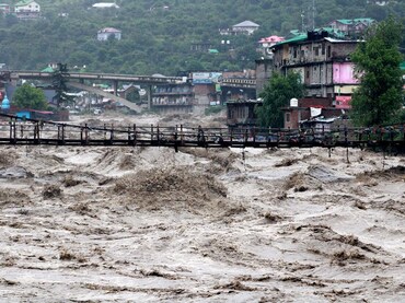 A view shows the overflowing river Beas following heavy rains in Kullu district in the northern stat