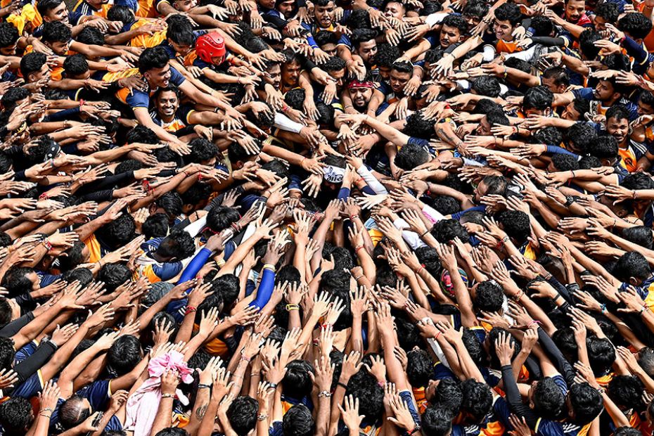 Hindu devotees prepare to form a human pyramid during celebrations to mark the Krishna Janmashtami f