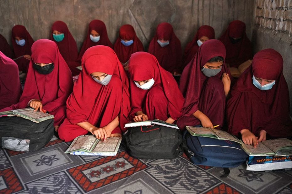 Afghan girls read the holy Koran at Madrassa Abdullah Bin Omar Darul Uloom (Islamic school) in Kanda