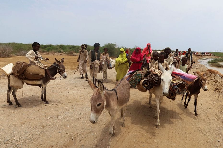 Evacuees move their belongings on donkeys following devastating floods in Tokar, Red Sea State, Suda