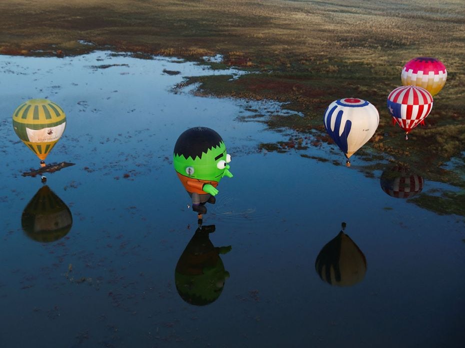 Hot-air balloons fly over Metropolitano Park during the International Hot-Air Balloon Festival in Le