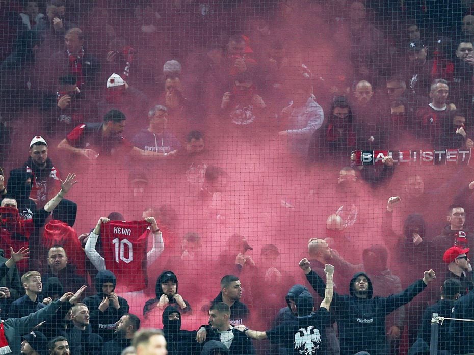 Albanian fans with flares fill the air with chants at the Nations League soccer match between Albani