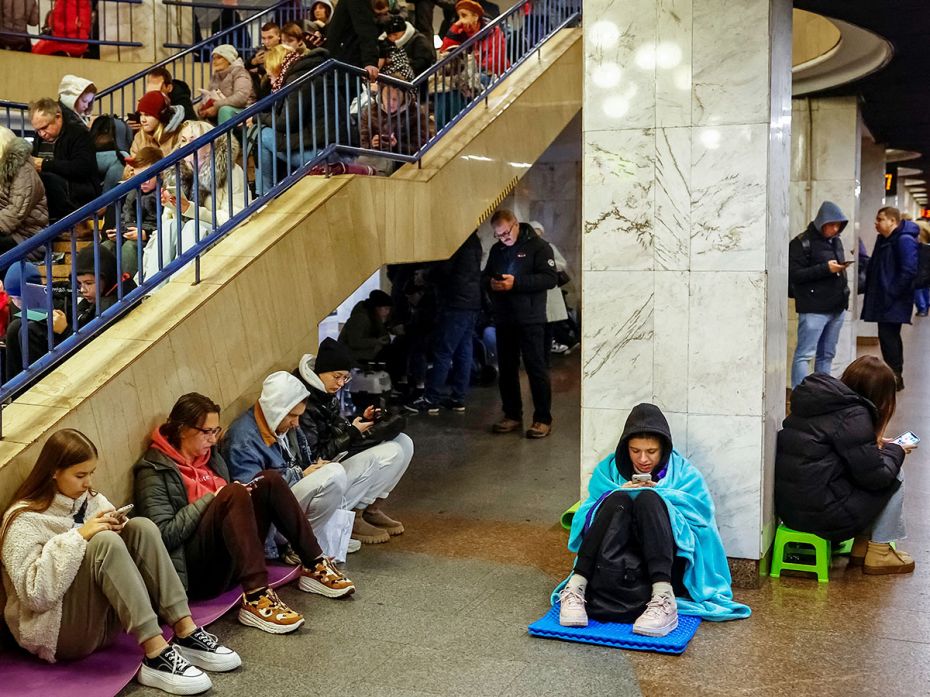 Following an air raid alert, people take shelter inside a metro station in Kyiv, Ukraine, on Novembe