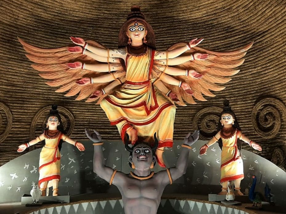 A winged Durga rises above her consorts in a coir-themed circular pandal in Siliguri, October 9, 202