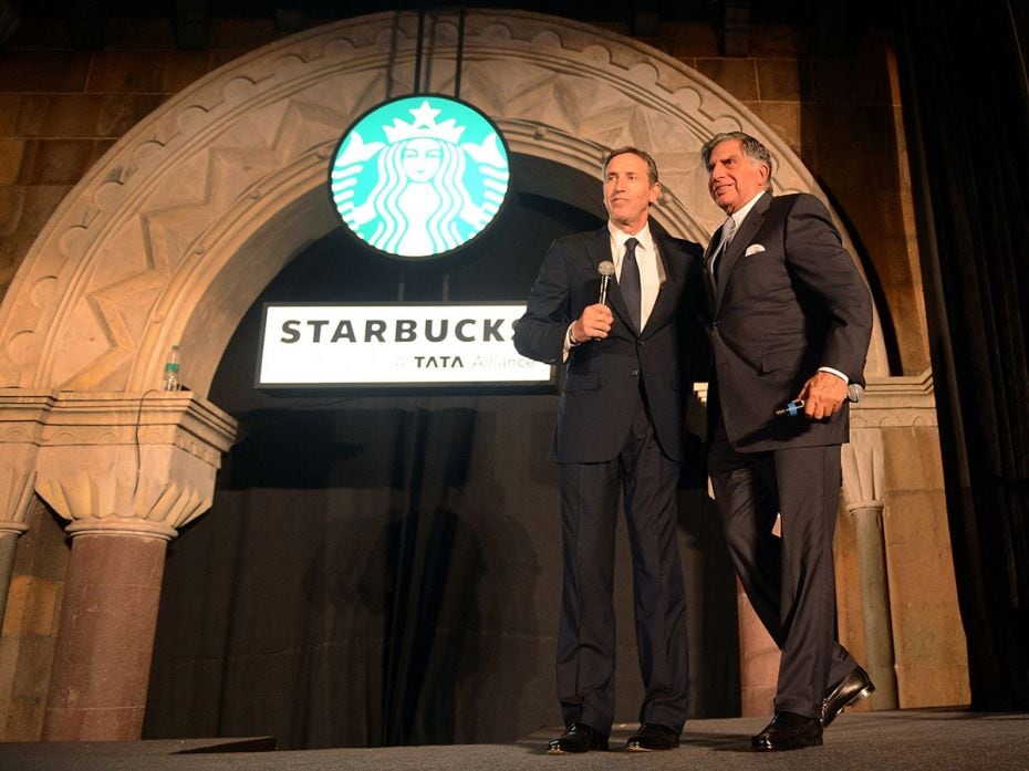 Starbucks Coffee Company's Chairman Howard Schultz (L) and Tata Group's Chairman Ratan Tata pose dur