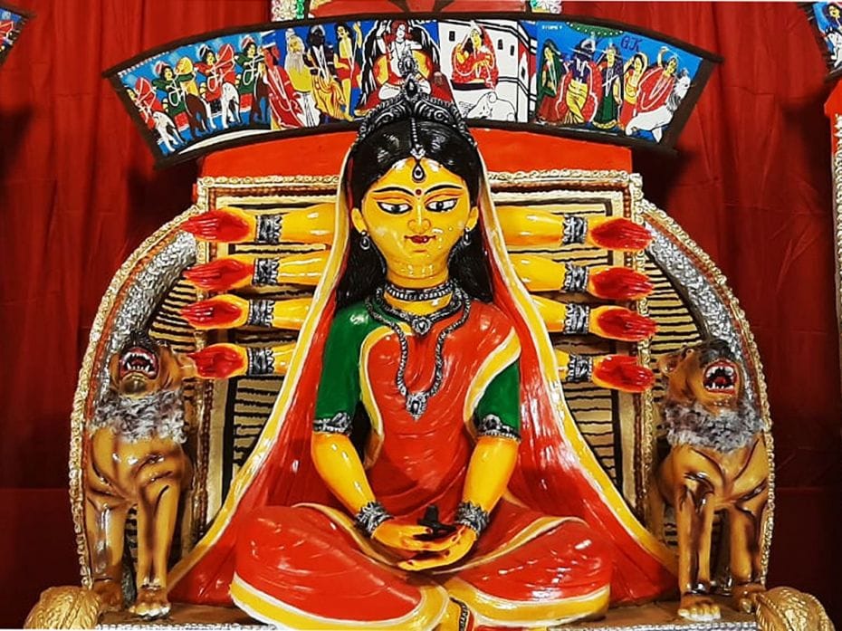 Durga appears as a simple householder in a folksy rendering at a pandal in Siliguri on October 9, 20