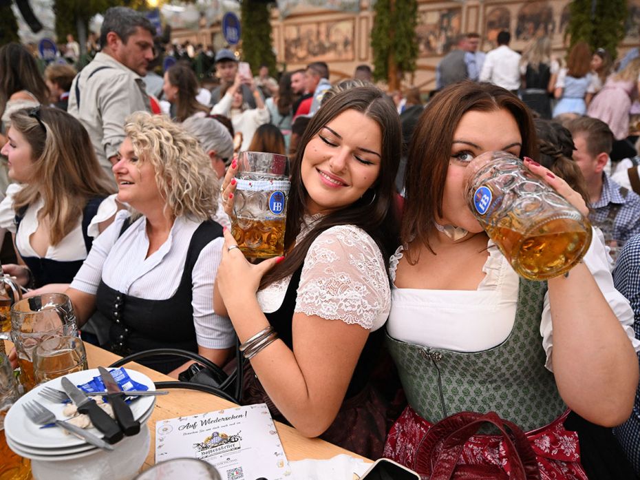 Revellers quaff in a festival tent at the world's biggest beer festival, the 189th Oktoberfest, in M