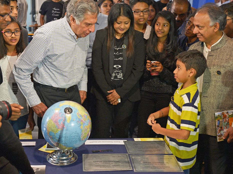 Ratan Tata speaks with a student during his visit to the Team Indus Foundation campus in Bangalore t