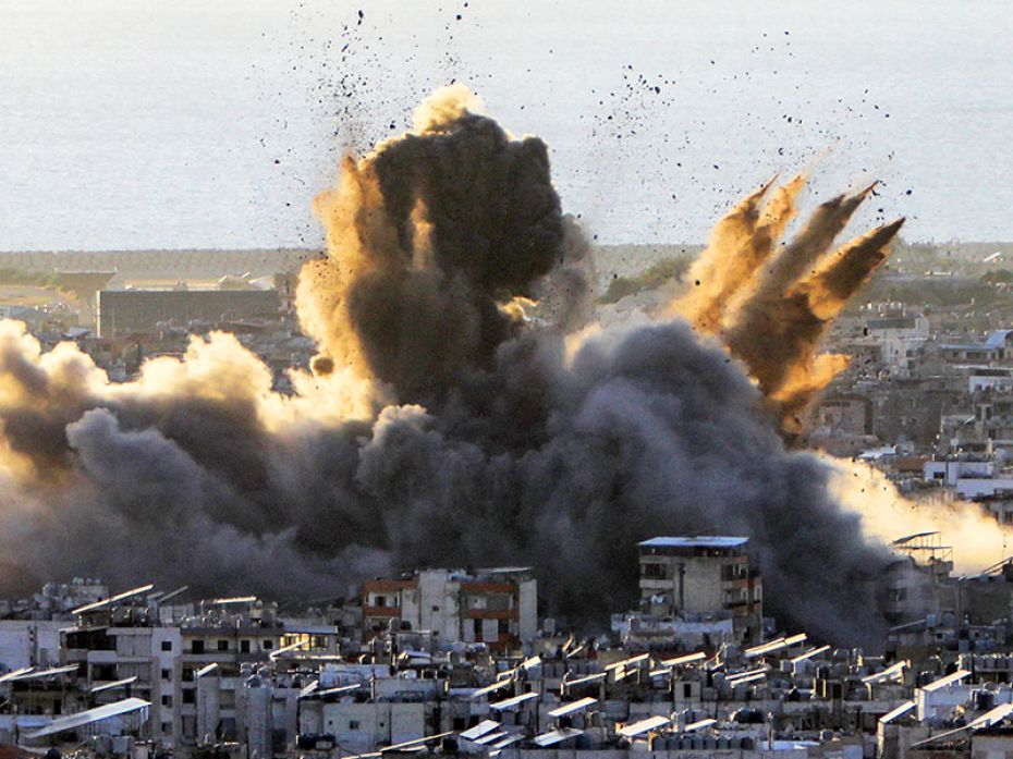 A cloud of dust and smoke erupts following an Israeli airstrike on Beirut's southern suburbs on Octo