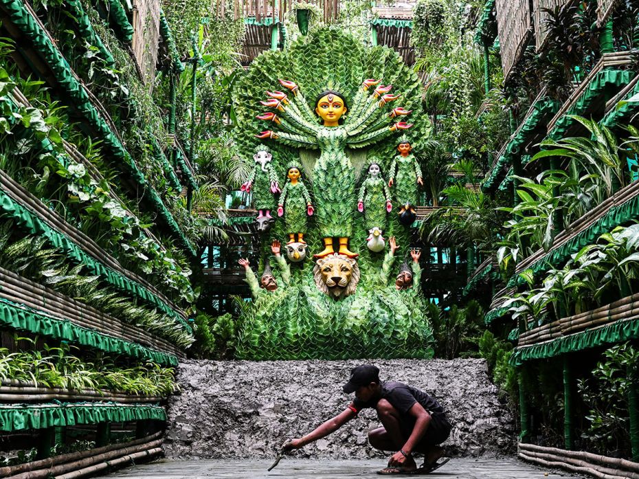 A green-themed pandal decorated with natural plants depicts Durga as Mother Nature herself in Kolkat