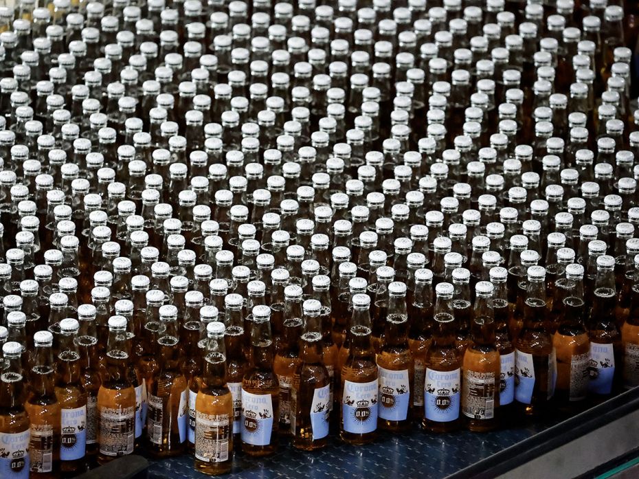 Bottles of Corona Cero alcohol-free beer move on a production line at the Anheuser-Busch InBev (AB I