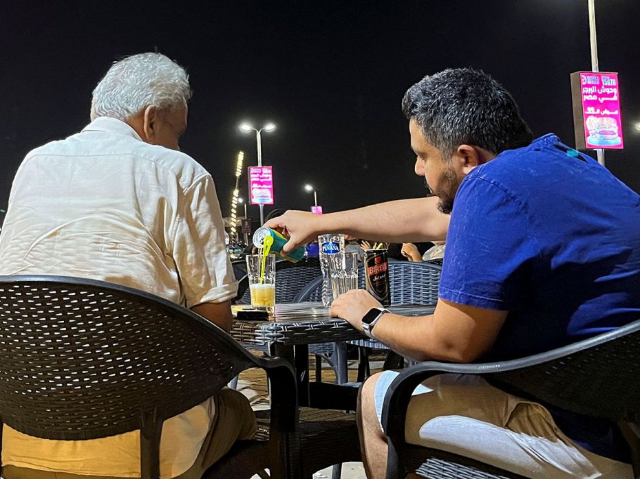 Egyptians drink Fayrouz and Birell, popular non-alcoholic malt beverages, at a cafe in Maadi, a subu