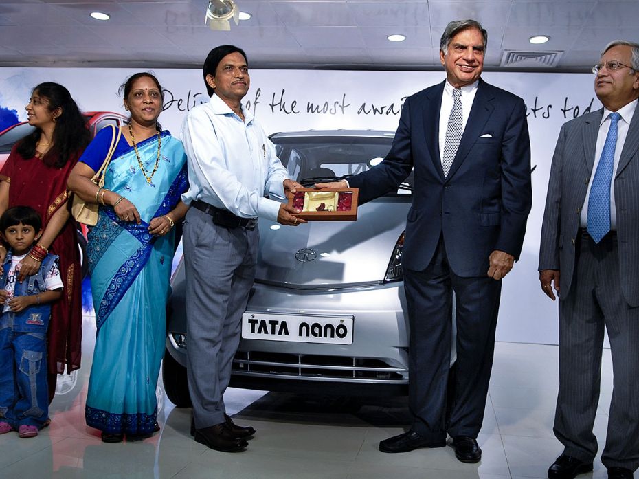 Ratan Tata, Chairman of Tata Motors, hands over keys of Tata Nano to its first owner, Ashok R. Vicha