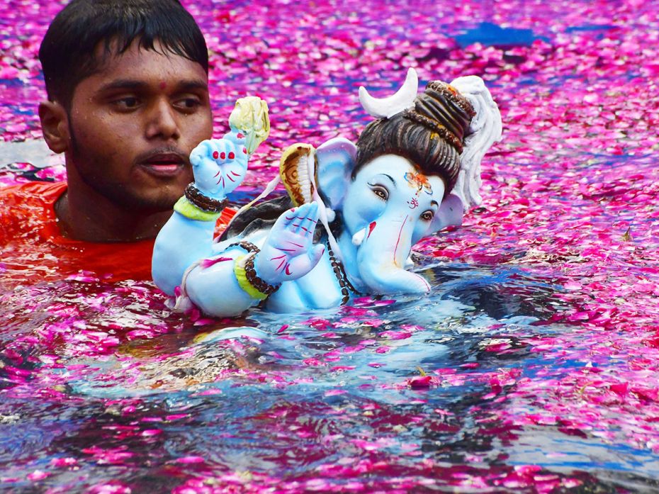 Adorned in dreadlocks and a crescent moon, Ganesha appears in the form and colour of his own  f