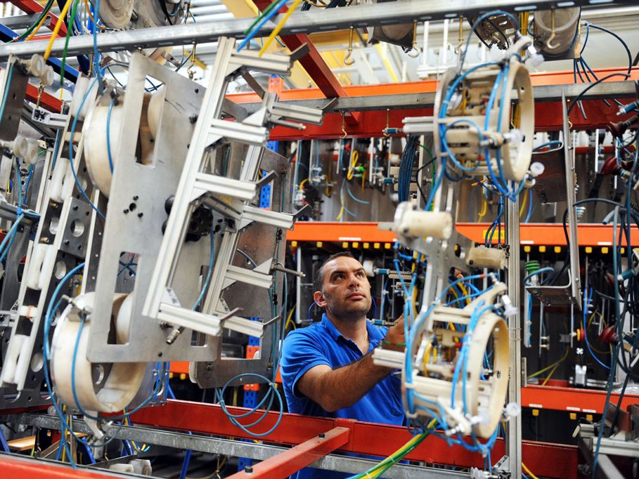 A file photo of an employee of Tupperware Brands Corporation storing moulds used to fabricate airtig