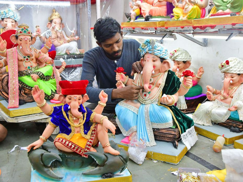 A Ganesh in a traditional fishermen’s robe sits on a crab at Ghadigaonkar Ganesh Workshop at L