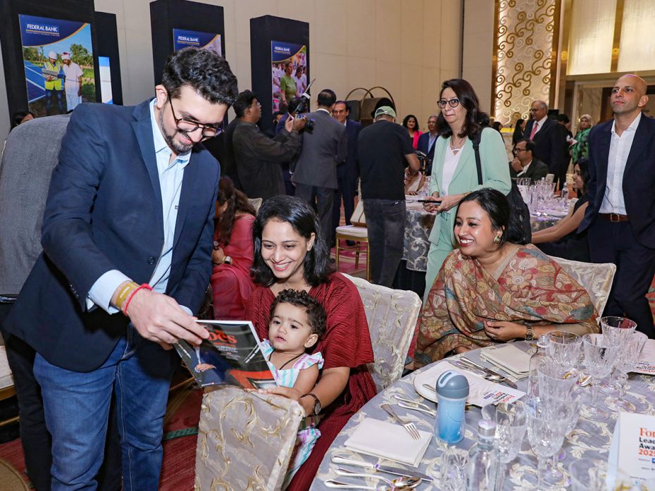 Krunal Patel, co-founder, Indra Water, shows the latest Forbes India Leadership Awards issue to his 